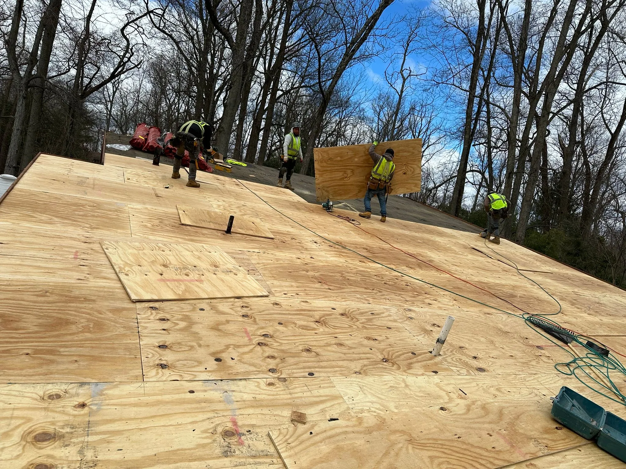 The flat roof stripped to new plywood decking before the insulation and EPDM membrane went on.