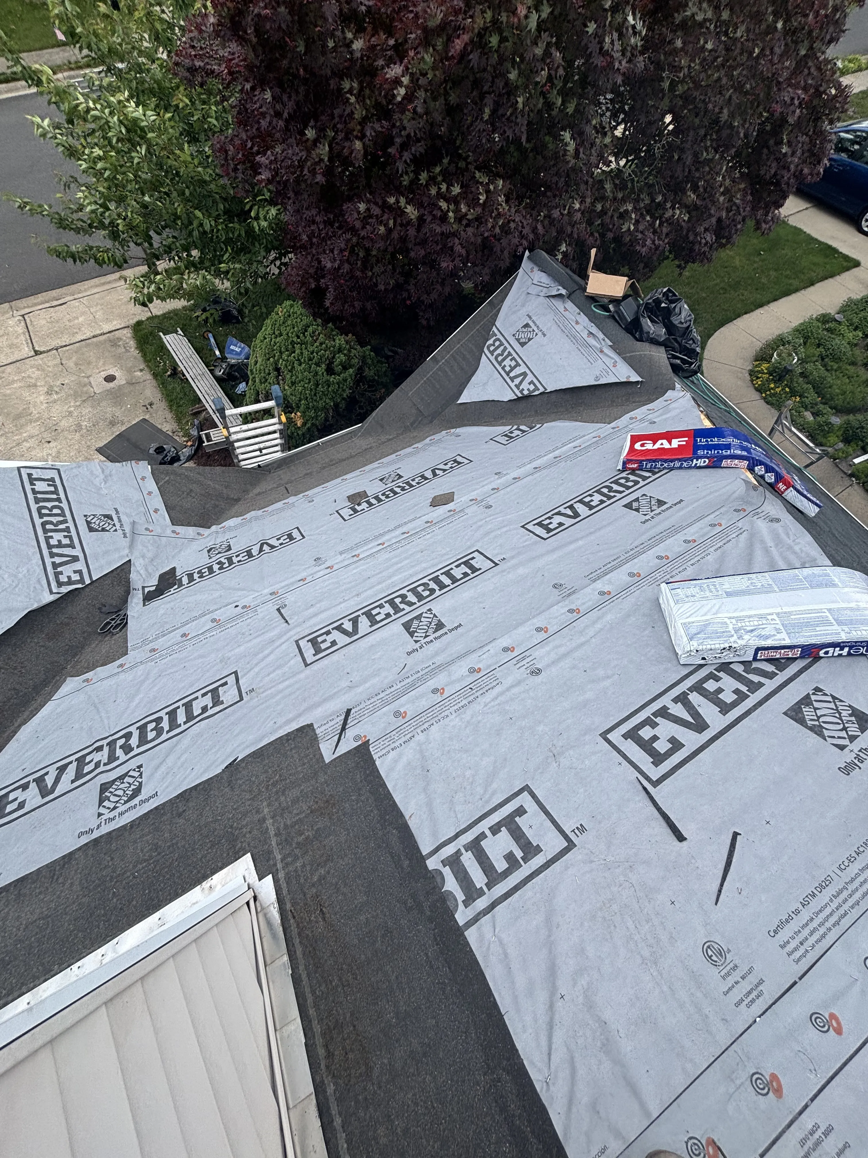 Underlayment and new valley and drip-edge metal installed, prepping the roof for the shingle install.